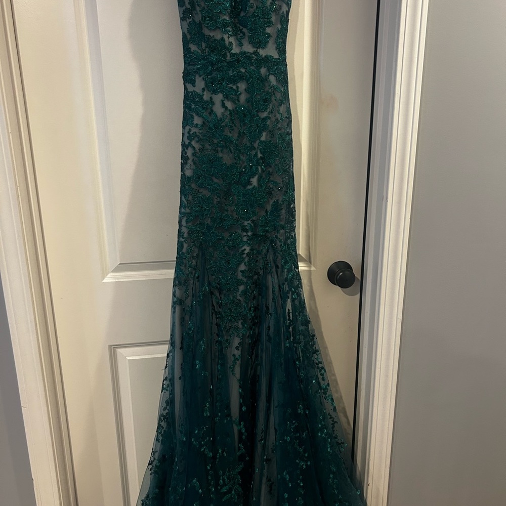 Beautiful prom dress. Dark green lace with slight train. Size 2/4 worn once.